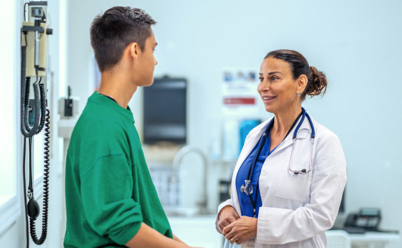 doctor talking with a young boy